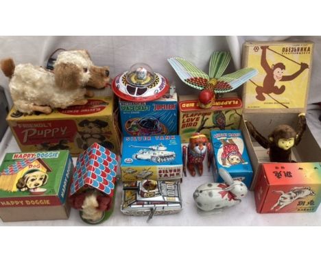 Tinplate: A vintage tinplate collection to include battery operated Alps Friendly Puppy, clockwork Happy Doggie, Silver Tank,