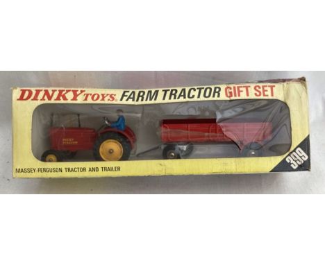 Dinky: A boxed Dinky Gift Set 399, Farm Tractor and Trailer. Contains Massey Ferguson Tractor with Driver in excellent origin