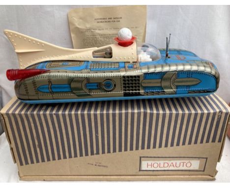 Tinplate: A vintage tinplate Lemezaru Gyar battery operated space craft made in Hungary. This is the early Holdauto ball blow