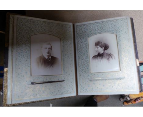 A smaller Photograph Album and contents of portrait photographs. 
