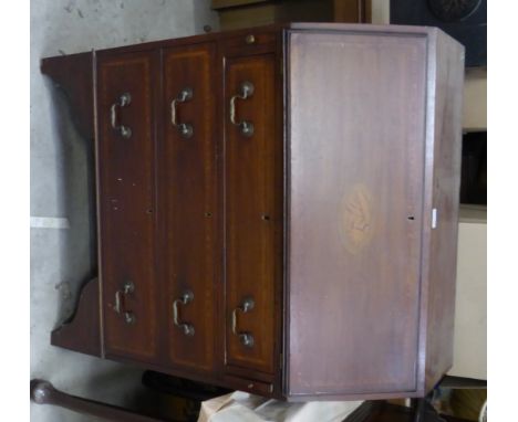 An Edwardian mahogany Bureau with crossbanded and shell inlaid fall, with three long drawers under, on bracket feet.  2' 6" (