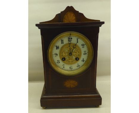 An Edwardian Mantel Clock with white and gilt dial and gong strike in inlaid mahogany case.   11" (28cms) high. 