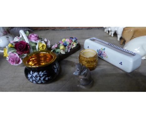 A Royal Copenhagen Figure of an otter eating a fish, Poole pottery flower trough, two posies, etc. 