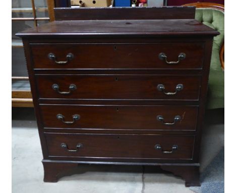 A mahogany three piece Bedroom Suite comprising wardrobe enclosed by mirror panelled door and with domed cornice, single draw