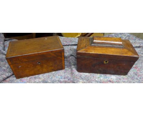 A 19th century mahogany Tea Caddy with cross banded decoration, the interior fitted with two covered containers, and one othe
