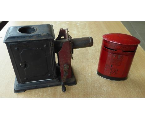 A small metal Magic Lantern and Chad Valley Money Box.
