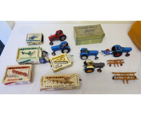 A number of Britains Farm Implements including four furrow plough no. 9551, high speed rake no. 9537, farm roller no. 9533, a