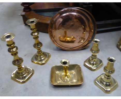 A pair of Victorian brass Candlesticks, 10 1/2" (26cms) high, a smaller pair, a chamber candlestick, and an engraved warming 