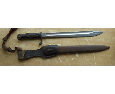 A German Mauser World War One Bayonet and Scabbard with bouillon knot.