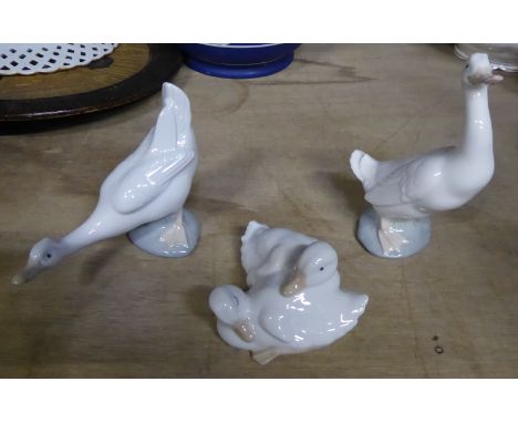 A Nao Figure Group of two ducks, boxed, another Nao duck, boxed, and one other. 
