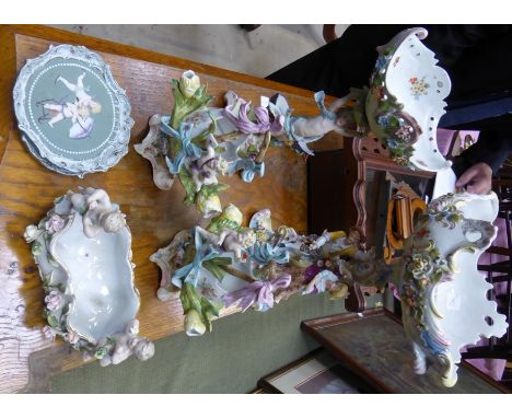 A Continental porcelain Comport decorated with applied flowers and figures, etc., 14" (36cms) high (cracked); a smaller compo