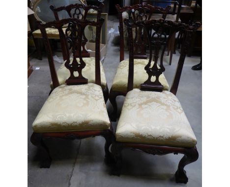 A set of four Chippendale design mahogany frame Dining Chairs with pierced splat backs, upholstered seats and cabriole suppor
