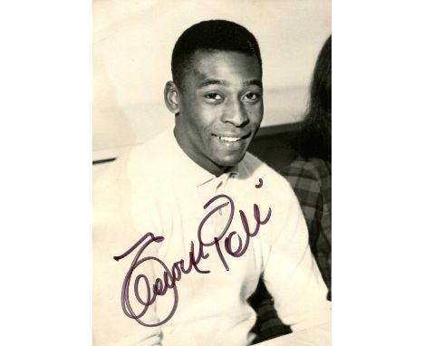 PELÉ: (1940-2022) Brazilian footballer. A good vintage signed 4 x 6 photograph of the young player seated in a half-length po