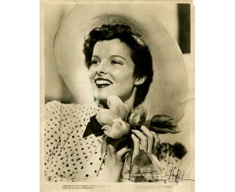 HEPBURN KATHARINE: (1907-2003) American actress, Academy Award winner. Vintage signed sepia 8 x 10 photograph of Hepburn in a