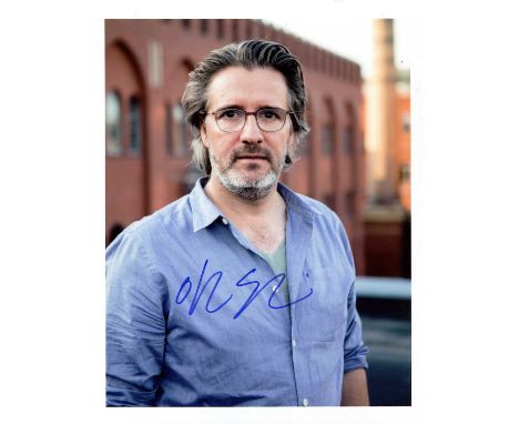 ELIASSON OLAFUR: (1967- ) Icelandic-Danish artist. Signed colour 8 x 10 photograph of Eliasson standing outdoors in a half-le