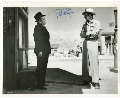 RYAN ROBERT: (1909-1973) American actor. Vintage signed 10 x 8 photograph or Ryan standing outdoors in a full-length profile 