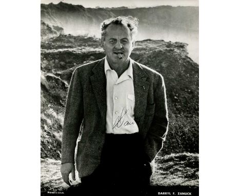 ZANUCK DARRYL F.: (1902-1979) American film producer and studio executive. Signed 8 x 10 photograph of Zanuck standing outdoo