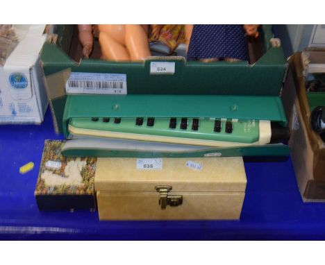A jewellery box and a Hohner melodic mouth organ in original case