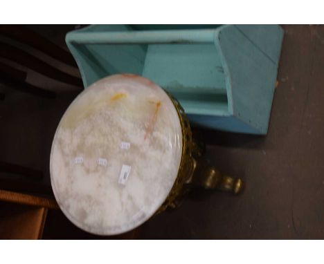 An onyx topped gilt tripod table
