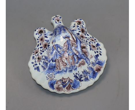 A 19th century Delft flask of shell form, decorated with figures and hunting scene