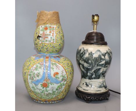 A Chinese Kangxi period blue and white vase, converted to a lamp and a 19th century Chinese famille rose vase (a.f.) tallest 