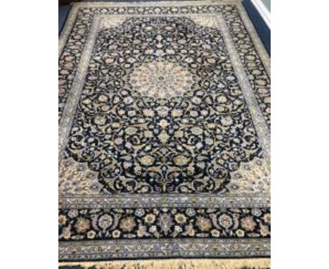 A Tabriz style blue ground carpet 388 x 279cm
