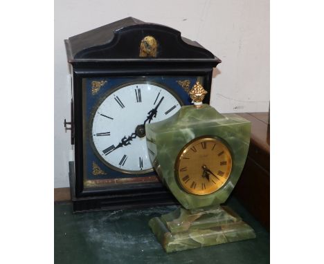 A 19th century cuckoo clock and an onyx timepiece