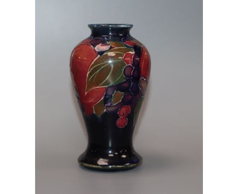 A Moorcroft miniature pomegranate baluster vase