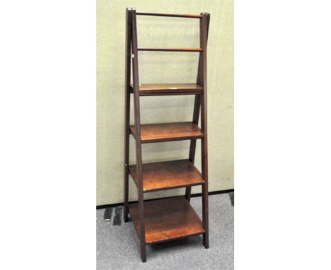 A modern graduated ladder style pine storage shelf, height 133 cm