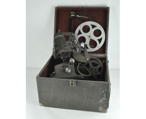 A 1950's Bell &amp; Howell-Gaumont 16 mm cine film projector, model 613, with power cable, reels, instruction manual, in orig