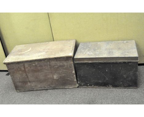A large wooden trunk with a hinged lid and metal handles to either side, width 79 cm, together with a metal example, width 65