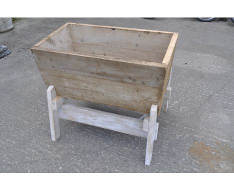 A pine wooden trough on stand, 76.5 cm high x 89 cm wide x 55 cm deep
