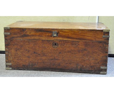 A possibly 19th Century mahogany campaign trunk, with brass-bound corners, handles and escutcheon missing, 80cm x 35cm x 38cm