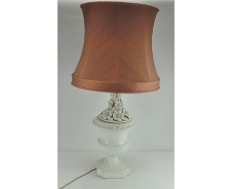 A white ceramic table lamp with floral decoration and a pink shade, height 100cm