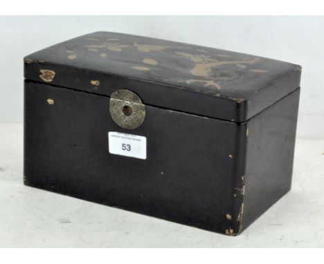 An Oriental black lacquered tea caddy, decorated with a snake, bird and blossoms, with brass clasp, (one of the inner lids is