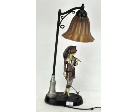 A contemporary lamp, modelled as a woman in Art deco attire standing underneath a lamp post, height 53cm 