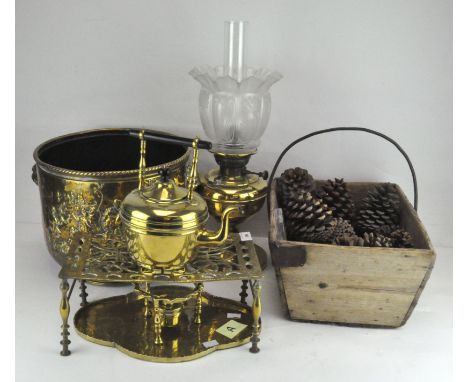 A group of brassware, including a kettle, jardiniere, trivet, oil lamp, copper and brass warming pan and a coal bucket with l