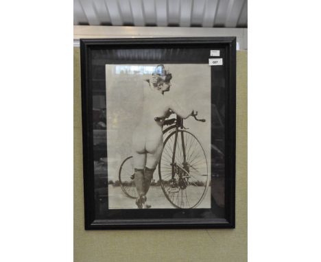 A 'Gear of Carnaby Street Ltd' risque print, depicting a nude woman beside a bicycle, 42cm x 29.5cm, framed and glazed