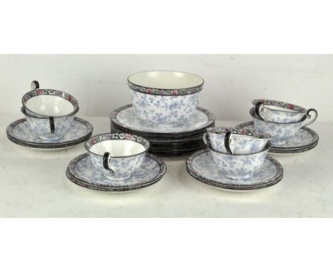 A Royal Doulton tea service, circa 1910, printed green marks, printed with floral decoration, comprising seven cups, eight sa