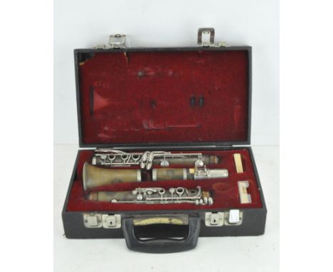 A vintage King Lemaire Paris clarinet, in original carry case with red interior