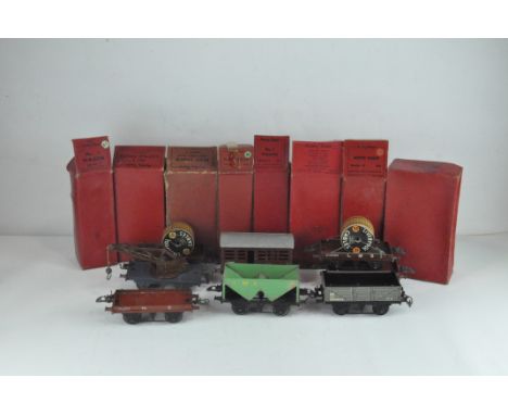 Six items of Hornby O Gauge LMS Railway Company freight and rolling stock, comprising a R166 Hopper Wagon, 12T 48744 Cattle T