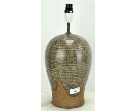 A Studio pottery stoneware lamp base, glazed with stylised decoration, height 38cm