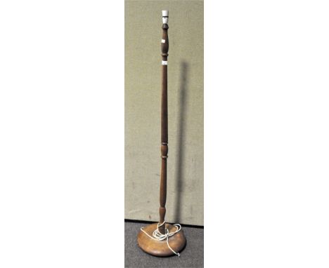 An oak floor lamp, on spreading base, mid-20th century, 155 cm high overall 