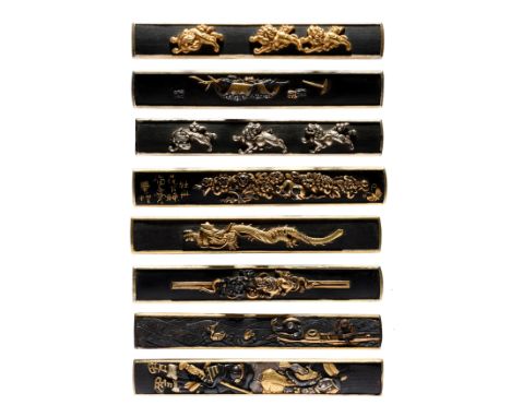 A small collection of Japanese kogatana handles (kozuka), each gilt on the back and edges, the faces with encrusted decoratio