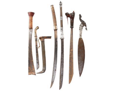 A collection of South East Asian weapons, comprising: a Moro sword (barong), heavy leaf-shaped single-edged blade 16 in., sil