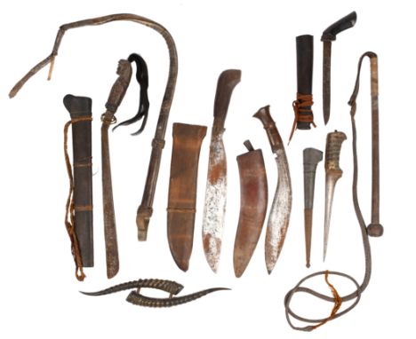 A collection of Asian edged weapons and other items, including: a Persian dagger (peshkabz), a kukri, a Dyak jungle knife (pa