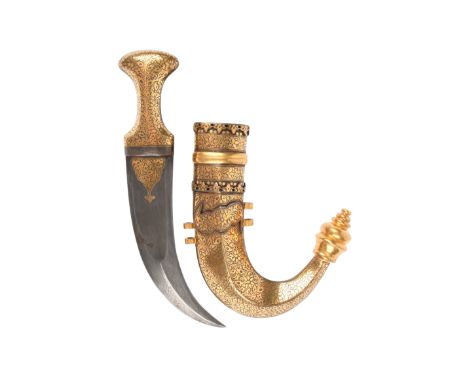 A Yemeni dagger (assib jambiya), watered steel blade 7.75 in., flat sides giving way to a medial ridge leading to the curved 