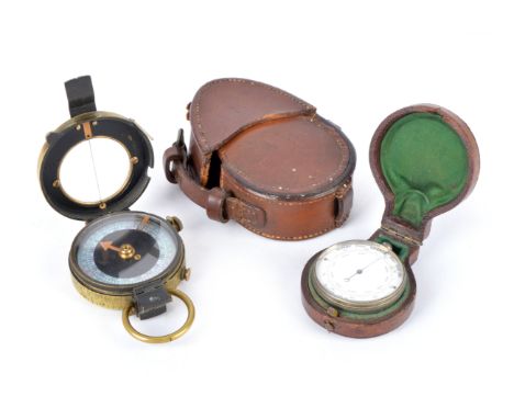 A British issue marching compass, by E. Koehn and dated 1918, in leather field case; together with an aneroid pocket baromete