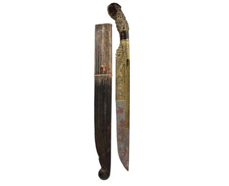 A Sinhalese knife (piha-kaetta), heavy single edged blade 9 in., the lower part and the fullers clad in brass with scrolling 