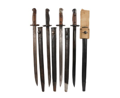 Four British 1907 pattern bayonets, three by Wilkinson and one unnamed, all with scabbards and the latter with a webbing frog